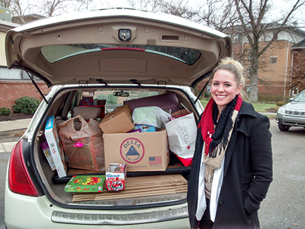 Kelsey Moss with a trunk full of toys
