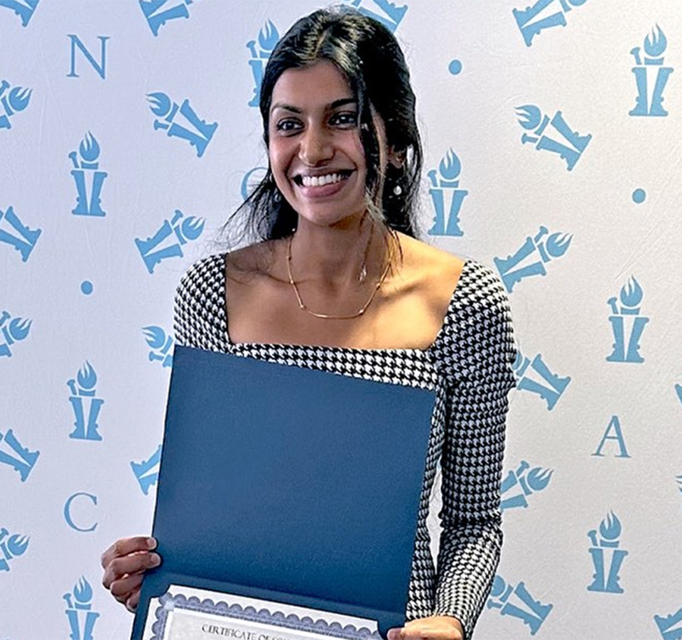 Akshaya Sudhakar headshot with award
