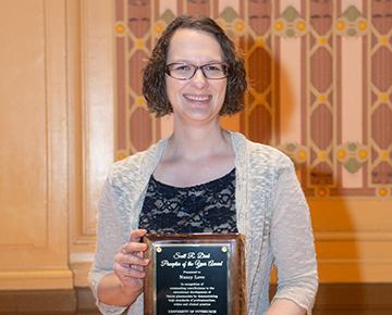 Nancy Love Headshot with award