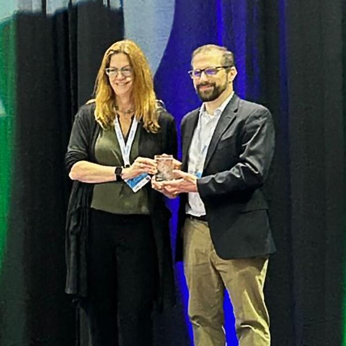 Dr. Philip Empey receiving award