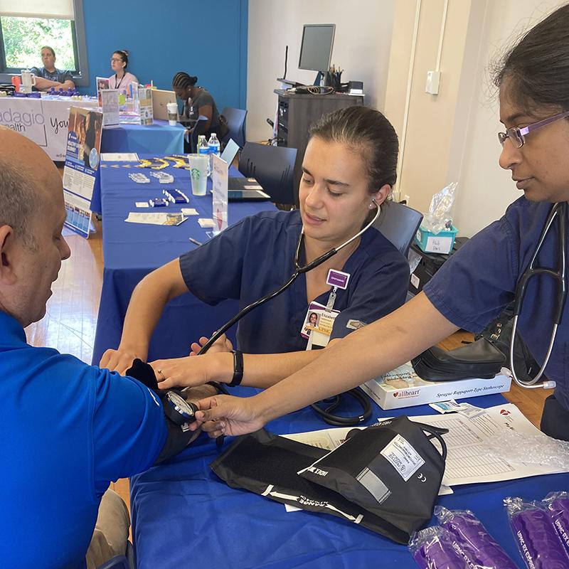 Two studentst with patient